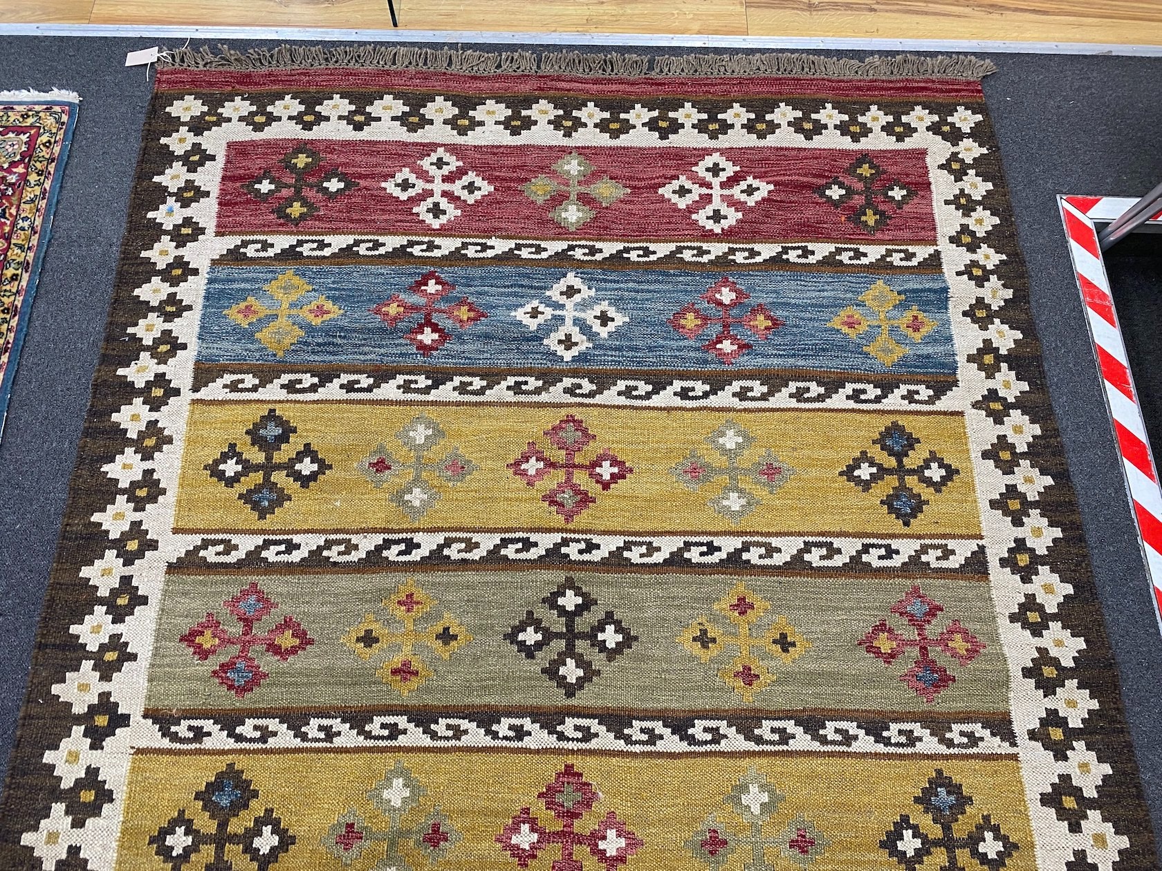 A Kilim polychrome flat weave carpet, 240 x 170cm
